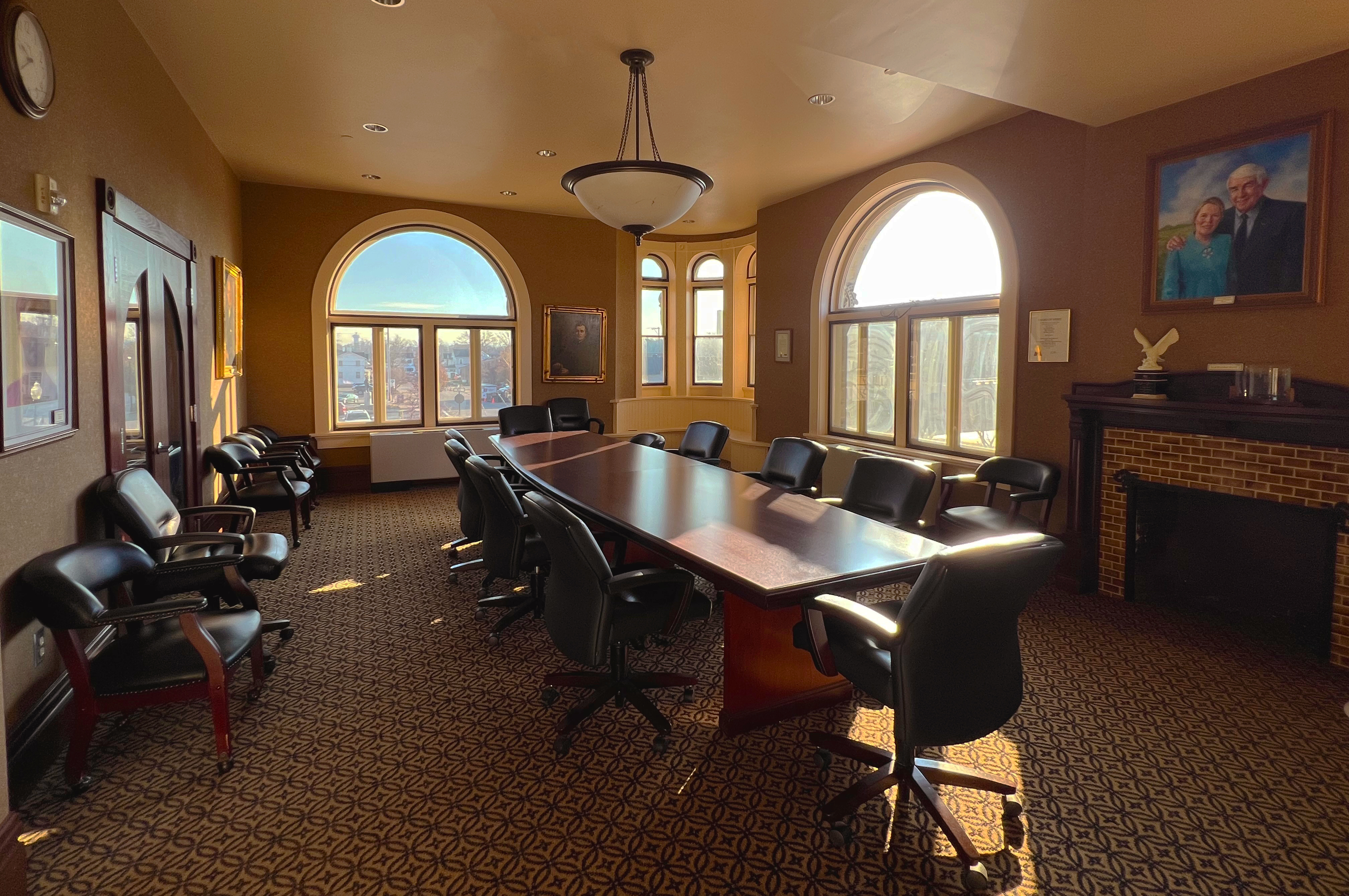 A long room with windows and a boardroom table