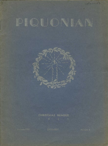 A scan of the cover of a publication called the Piquonian. It is a faded blue gray color, in the center is a wreath with a candle in the middle of it. At the top it reads PIQUONIAN and at the bottom it says Christmas Number 1931 Volume XXII December Number 2.