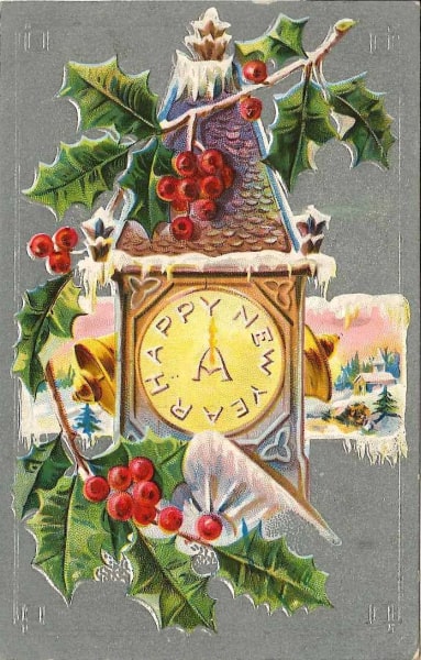 Historical New Year's postcard. A cuckoo clock with the words "Happy New Year" written on the clock face. The clock has bells on either side of it and a few springs of holly around it. In the background is a small, snowy country scene. The rest of the postcard is gray.